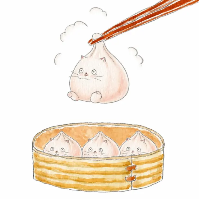 筷子夹起一只猫包子